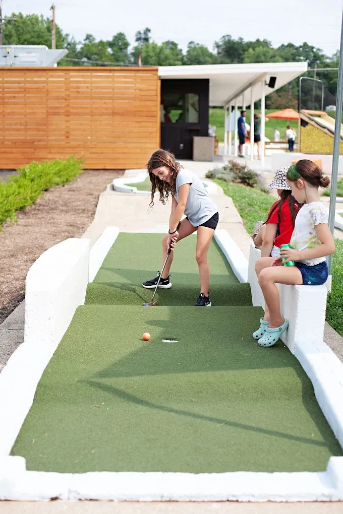 A round of mini golf underway at The Acres
